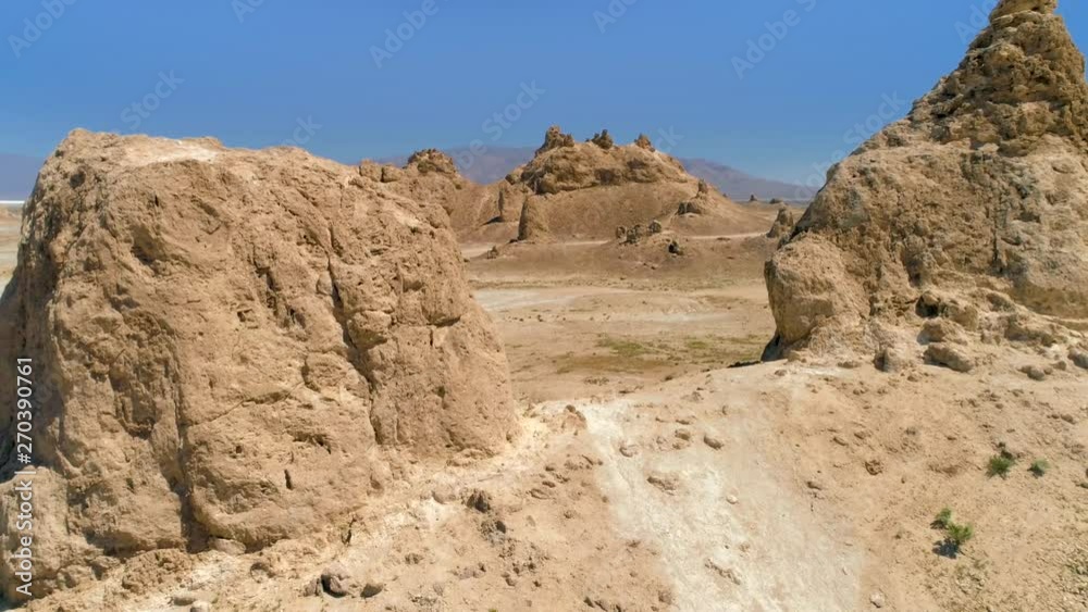 TRONA PINNACLES, CALIFORNIA, USA. Rock formations within rare natural landscape. Aerial 4K shot of enormous tufas within dry lake bed. TRONA PINNACLES, CALIFORNIA, USA. Rock formations within rare natural landscape. Aerial 4K shot of enormous tufas within dry lake bed.