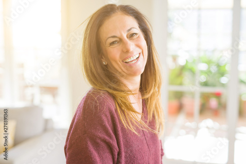 Beautiful middle age woman smiling at home Free Download Beautiful middle age woman smiling at home - GFXLoad