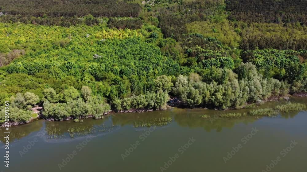 Aerial, drone flying. Young trees, plantations on the slopes. Aerial view on the Dniester Canyon, River, Bakota Bay in National Park Podilski Tovtry. Ukraine. Aerial, drone flying. Young trees, plantations on the slopes. Aerial view on the Dniester Canyon, River, Bakota Bay in National Park Podilski Tovtry. Ukraine.