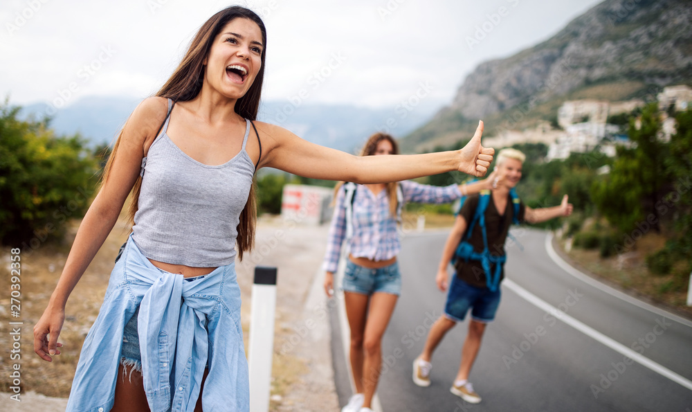 Group of friends with backpacks at summer outdoor. Group of friends with backpacks at summer outdoor.