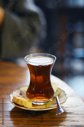 Tea in traditional turkish glass on a table