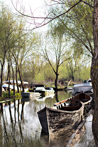 Danube river and fishing boat near the shore on a spring day. photo