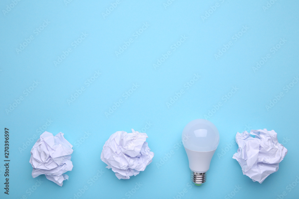 Crumbled paper on a blue background, composition