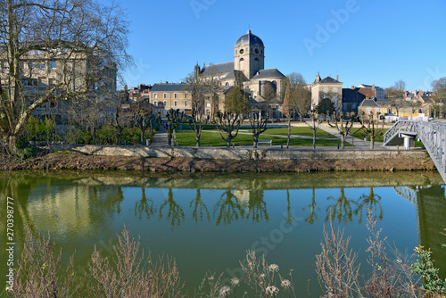 The river Sarthe with the basilica Notre Dame at Alençon of the Lower Normandy region in France