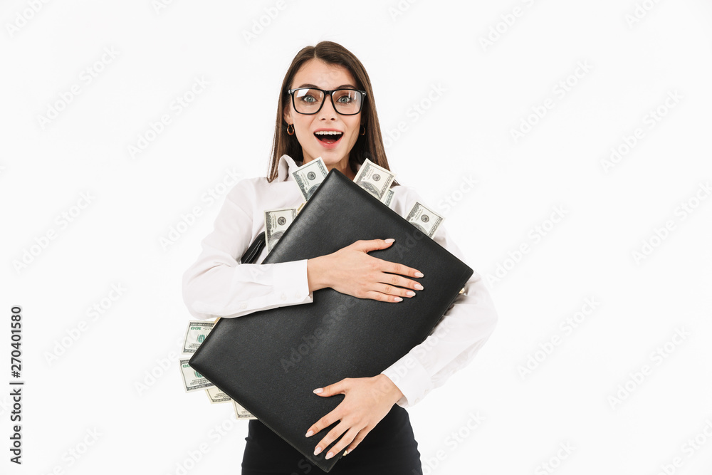 Photo of attractive female worker businesswoman dressed in formal wear holding briefcase full of dollar bills while working in office Photo of attractive female worker businesswoman dressed in formal wear holding briefcase full of dollar bills while working in office