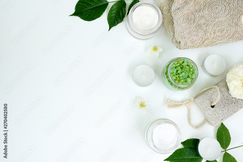 Spa aromatic sea salt, handmade natural spa products concept, view from above, space for a text on white background Spa aromatic sea salt, handmade natural spa products concept, view from above, space for a text on white background