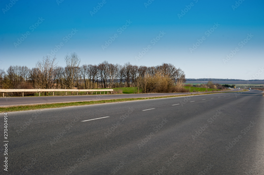 Fototapeta premium Spring asphalt road landscape