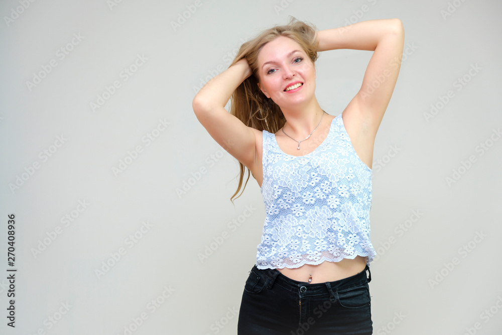 Life is beautiful and I like everything here. I am satisfied with life and I wish you. Portrait of a smiling beautiful blonde girl on a gray background in various poses. Life is beautiful and I like everything here. I am satisfied with life and I wish you. Portrait of a smiling beautiful blonde girl on a gray background in various poses.