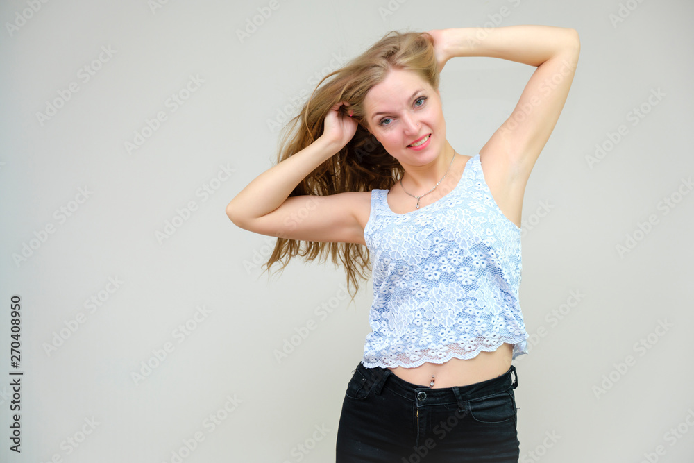 Life is beautiful and I like everything here. I am satisfied with life and I wish you. Portrait of a smiling beautiful blonde girl on a gray background in various poses. Life is beautiful and I like everything here. I am satisfied with life and I wish you. Portrait of a smiling beautiful blonde girl on a gray background in various poses.