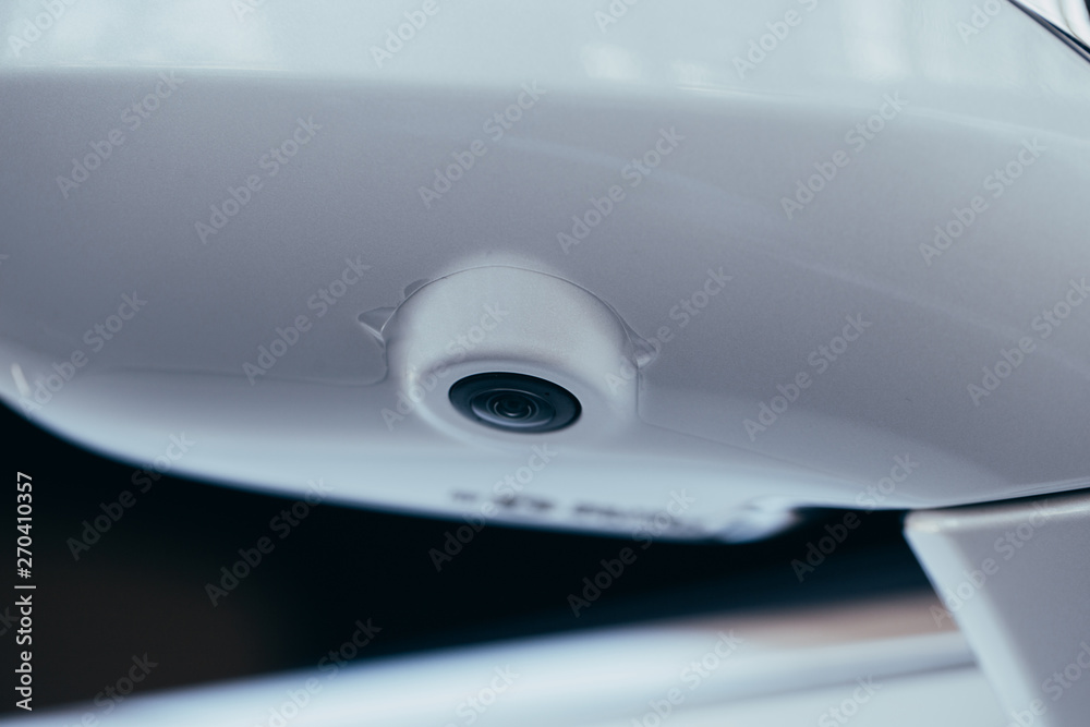 Close up of surround view 360 degrees camera system in the car mirror. Parking assistant and car help systems Close up of surround view 360 degrees camera system in the car mirror. Parking assistant and car help systems