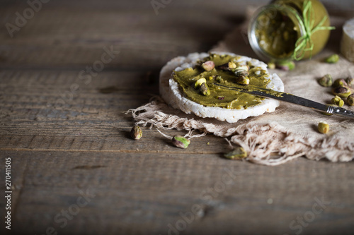 Pistachio nut butter creamed on a slice of rice crispbread.