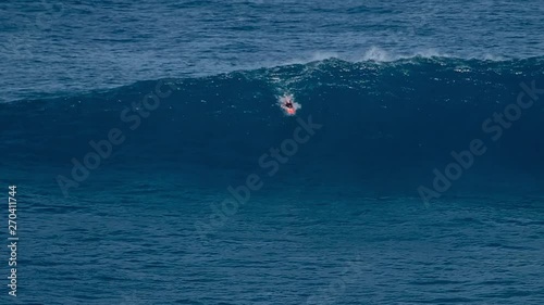 Wallpaper Mural Surfer rides the giant wave at the famous Jaws (Peahi) surf spot in Maui, Hawaii Torontodigital.ca