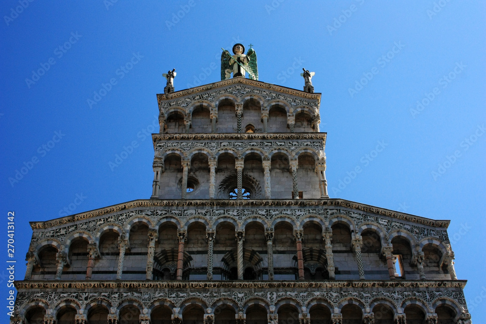Cathedral with an angel in the city of Lucca, Italy