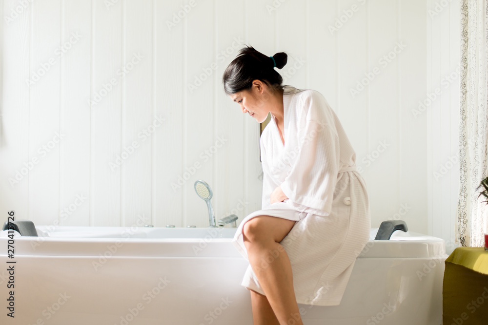 Beautiful asian female filling up with water and relax in bathtub at hotel,Happy and smiling Beautiful asian female filling up with water and relax in bathtub at hotel,Happy and smiling