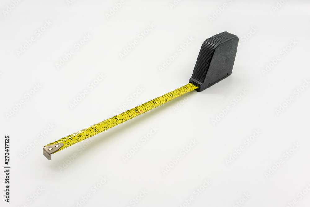 The measuring tape is isolated from the white background. The measuring tape is isolated from the white background.