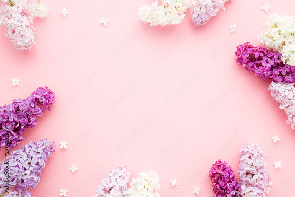 Fresh branches of purple, pink, white lilac blossoms on pastel color background. Empty place for inspirational, happy text, lovely quote or positive sayings. Flat lay. Fresh branches of purple, pink, white lilac blossoms on pastel color background. Empty place for inspirational, happy text, lovely quote or positive sayings. Flat lay.