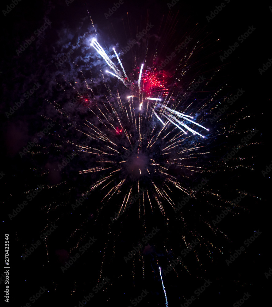 Beautiful sparks from fireworks in the sky at night Beautiful sparks from fireworks in the sky at night