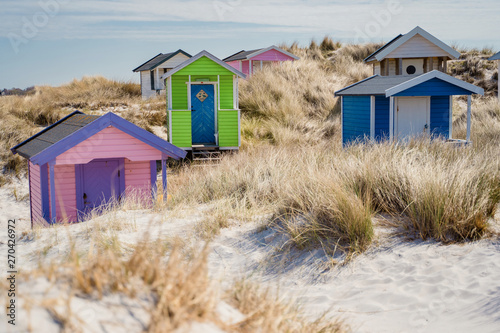 Colorful beach huts with clouds in background. Falsterbo, sweden © Elena Sistaliuk
