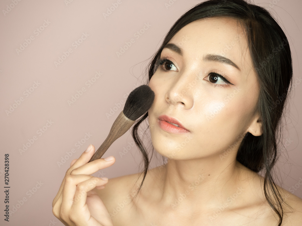 portrait asian beautiful woman.Closeup beauty skin face young girl.isolated white background portrait asian beautiful woman.Closeup beauty skin face young girl.isolated white background
