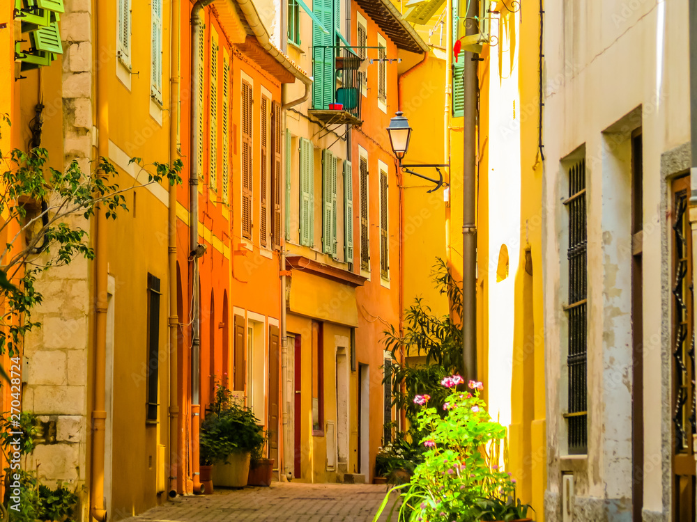 Bright yellow houses in the Villefranche-sur-Mer, of the Cote d'Azur, France