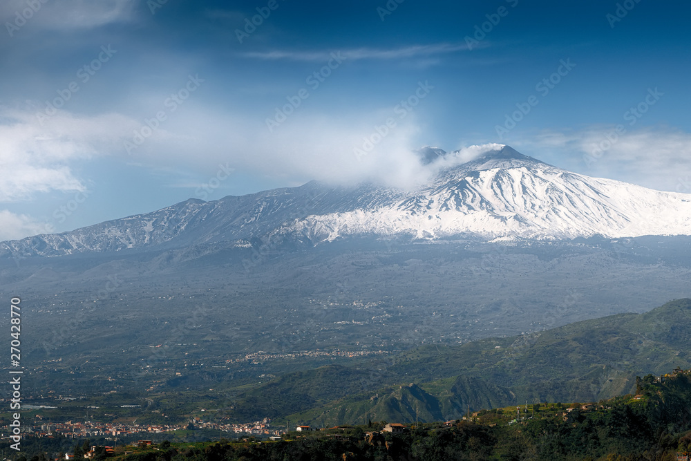 Smoking Mount Etna Volcano as seen from Taormina