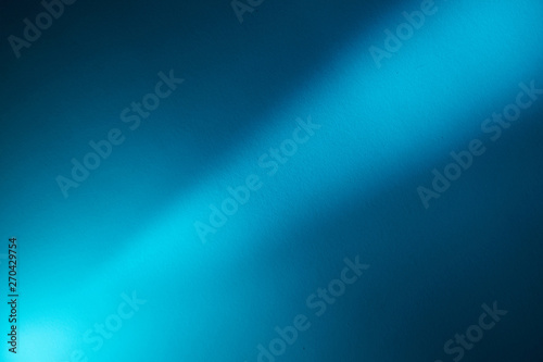 Bright beam of light on a dark background from the lower left corner to the upper right corner