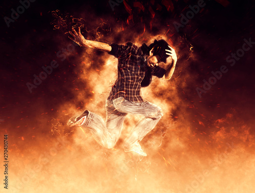 Man break dancing on fire background