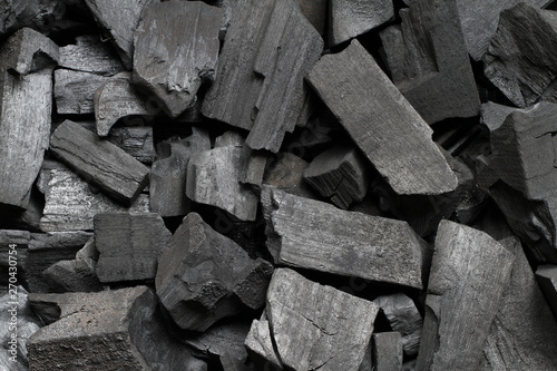 Black wood charcoal texture background © Winai Tepsuttinun