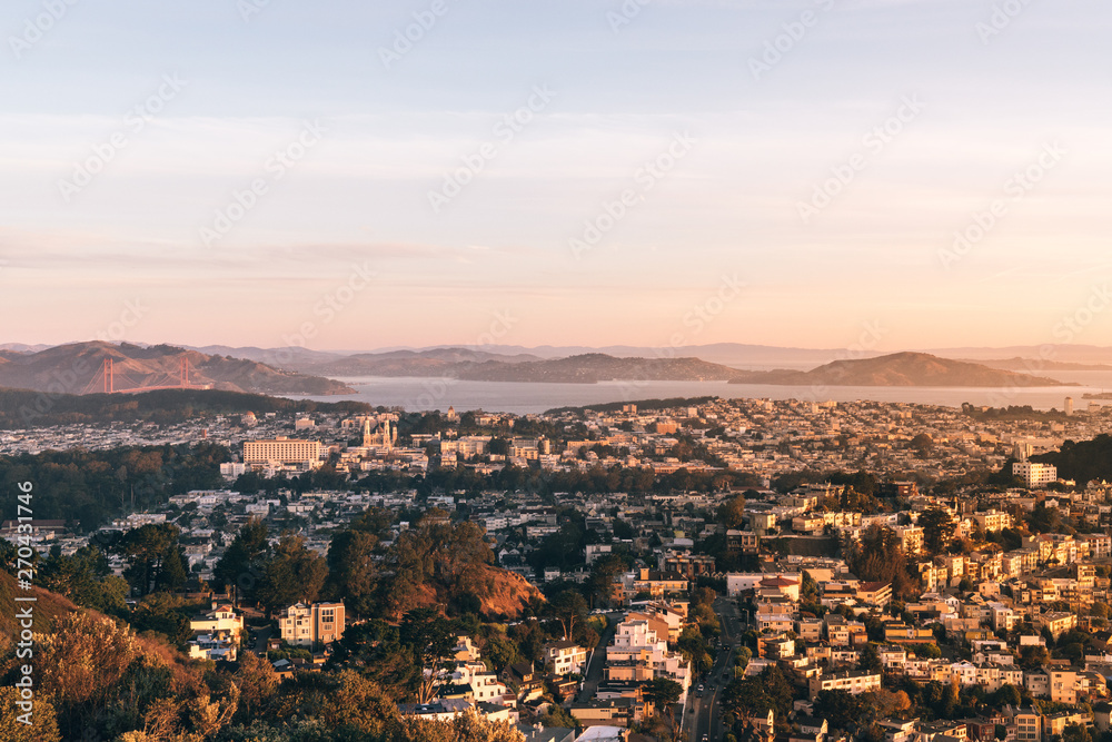 Landscape of San Francisco surrounded by mountains during a sunset