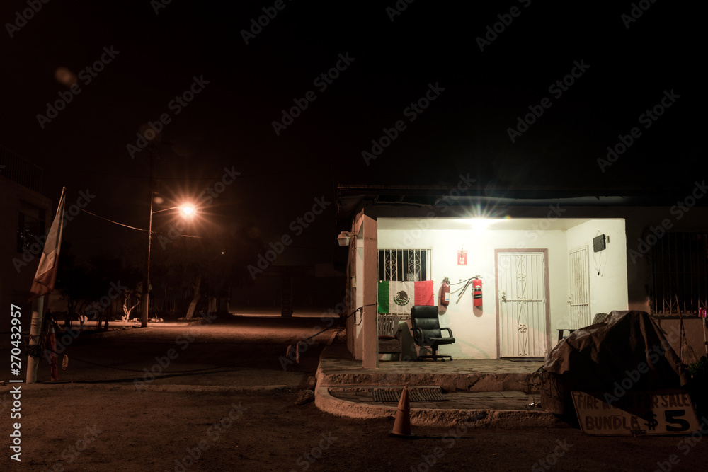 Booth in the middle of nowhere in Mexico with a mexican flag