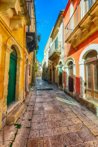 Walking around the old streets of  baroque town Ragusa Ibla in Sicily © pilat666