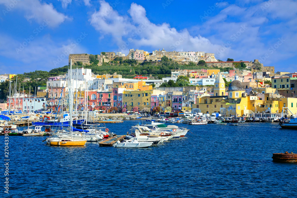 Boat filled port of the colorful island of Procida in the Bay of Naples, Italy