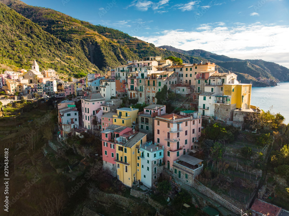 Aerial view of Corniglia, nestled in the middle of the five centuries-old villages of Cinque Terre, Italian Riviera, Liguria, Italy.
