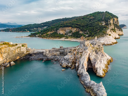 Aerial view of the Gothic-style Church of St. Peter sitting atop a rocky headland in Porto Venere village, Liguria, Italy photo