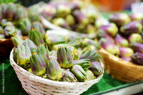 Assorted organic artichokes sold on a marketplace in Genoa, Italy photo