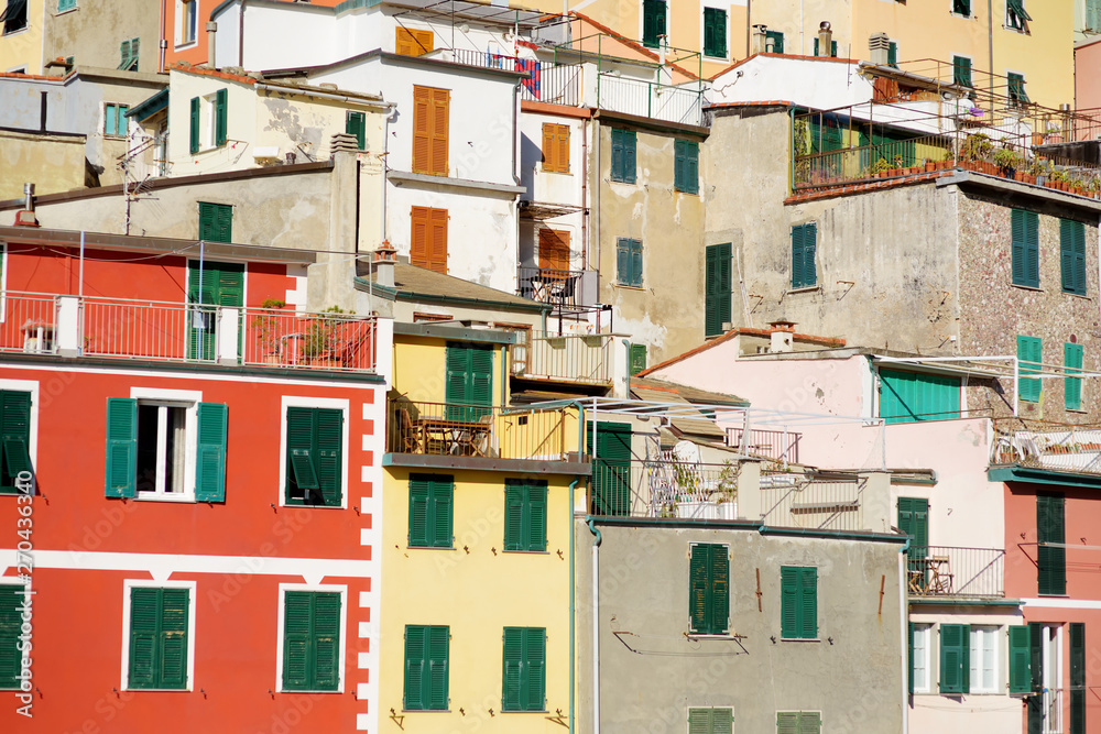 Pastel houses of Riomaggiore, the largest of the five centuries-old villages of Cinque Terre, Italian Riviera, Liguria, Italy.