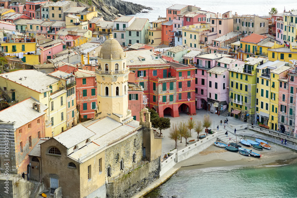Colourful houses and small marina of Vernazza, one of the five centuries-old villages of Cinque Terre, located on rugged northwest coast of Italian Riviera.