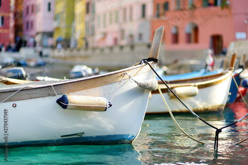 Colourful fishing boats in small marina of Vernazza, one of the five centuries-old villages of Cinque Terre, located on rugged northwest coast of Italian Riviera. © MNStudio