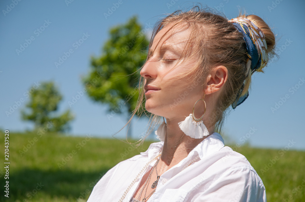 Beautiful boho style woman with accessories and romantic hairstyle, enjoy sunny day. Beautiful boho style woman with accessories and romantic hairstyle, enjoy sunny day.
