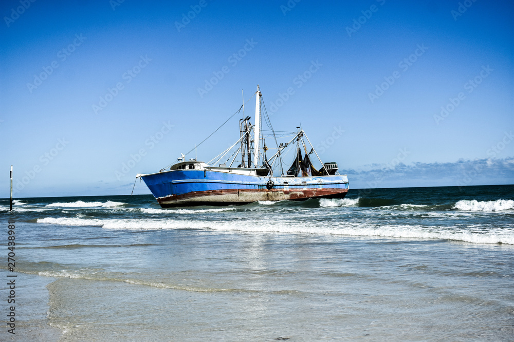 Abandoned and Moored Fishing Trawler Nautical Vessel Shipwrecked on the Atlantic Ocean along the Coast of Florida Abandoned and Moored Fishing Trawler Nautical Vessel Shipwrecked on the Atlantic Ocean along the Coast of Florida