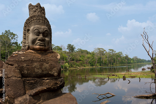 Stone carved statue of Devas on South Gate Bridge to Angkor Thom in Angkor complex, Siem Reap, Cambodia