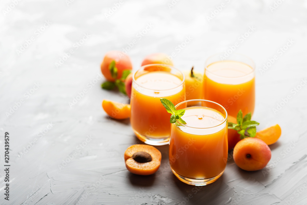 Fresh apricot juice on the marble table Fresh apricot juice on the marble table
