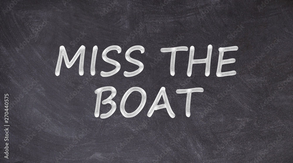 Fototapeta premium Miss the boat written on blackboard