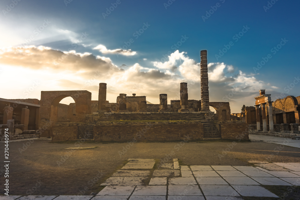 Ruins of Forum at sunset, Pompeii, ancient roman city against Vesuvius volcano, Italy