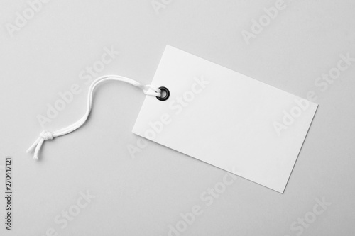 Cardboard tag with space for text on light background, top view