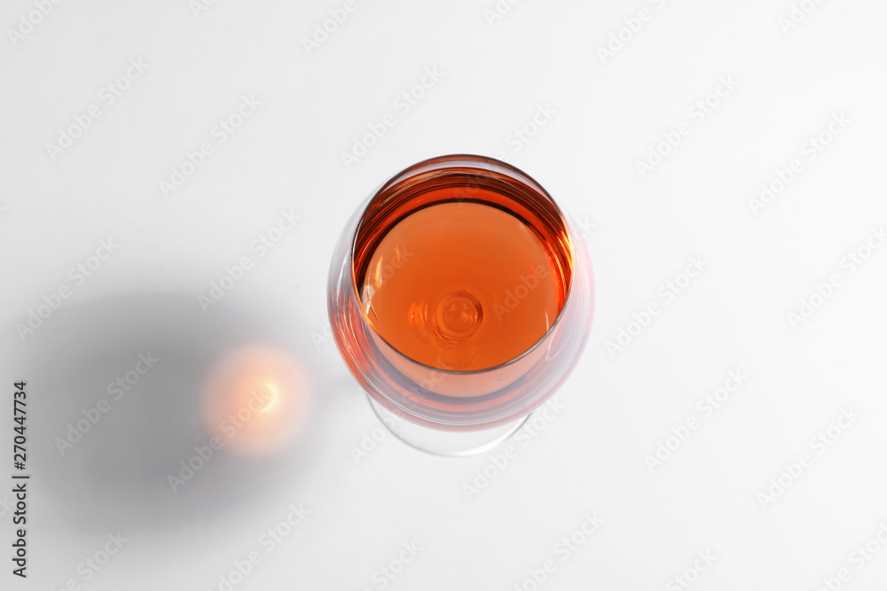 Glass of rose wine on white background, top view Glass of rose wine on white background, top view