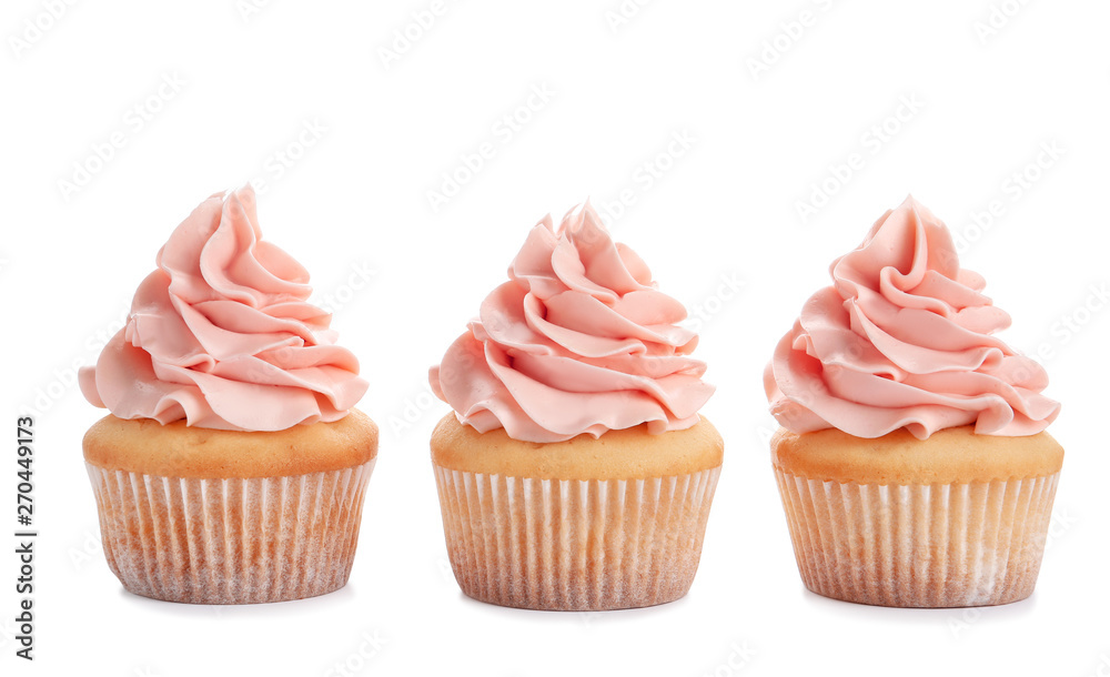 Delicious cupcakes with cream on white background