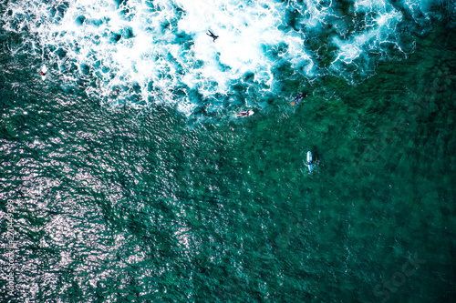 Aerial view of surfers on ocean and summer time 