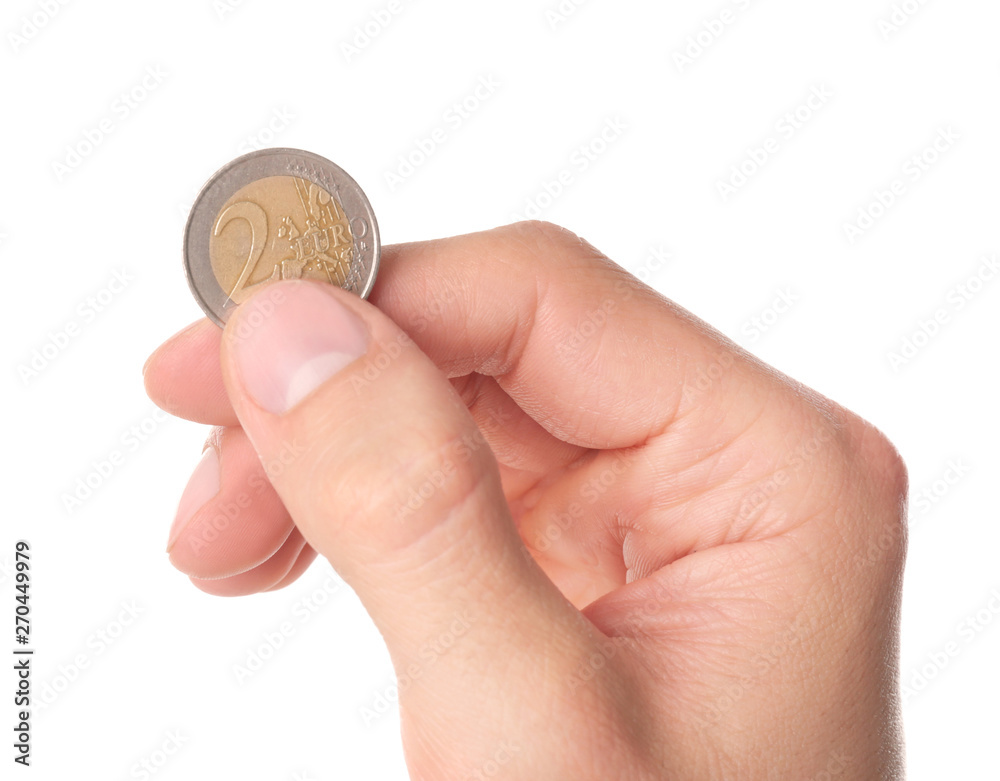 Man holding coin in hand on white background, closeup Man holding coin in hand on white background, closeup