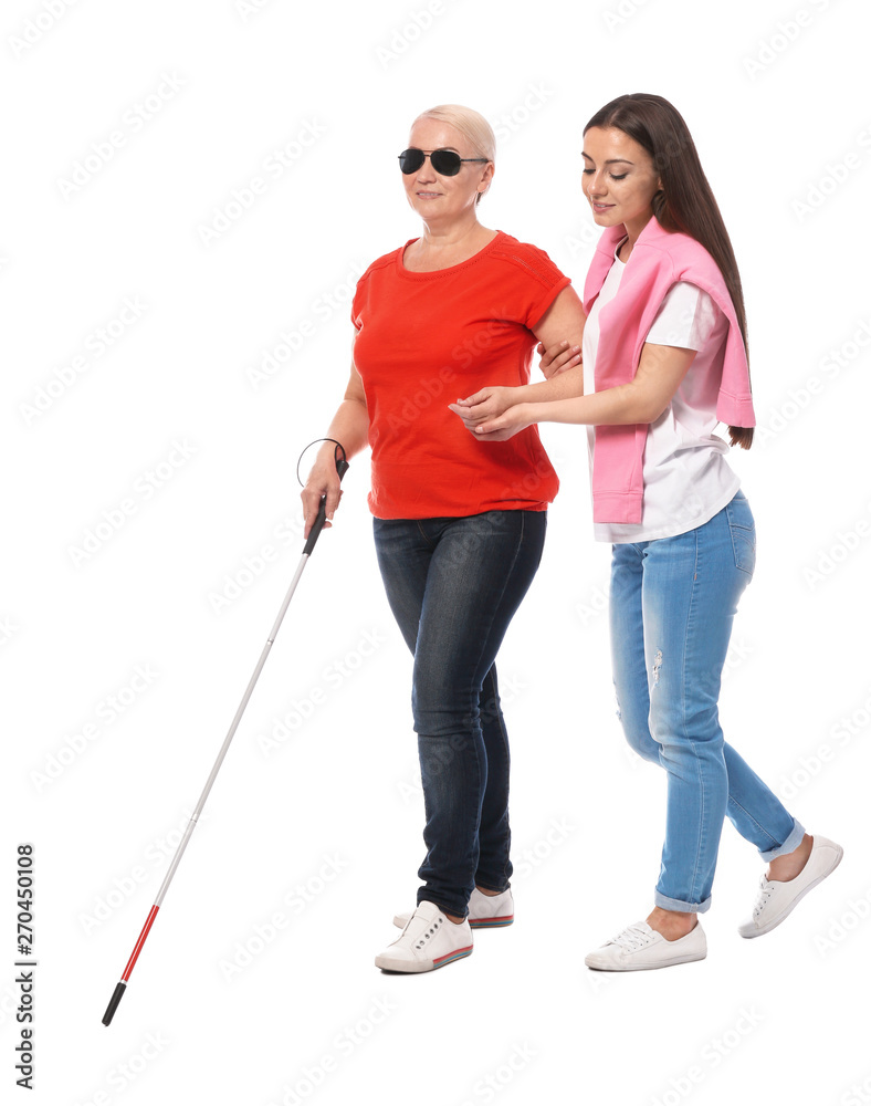 Young woman helping blind person with long cane on white background Young woman helping blind person with long cane on white background